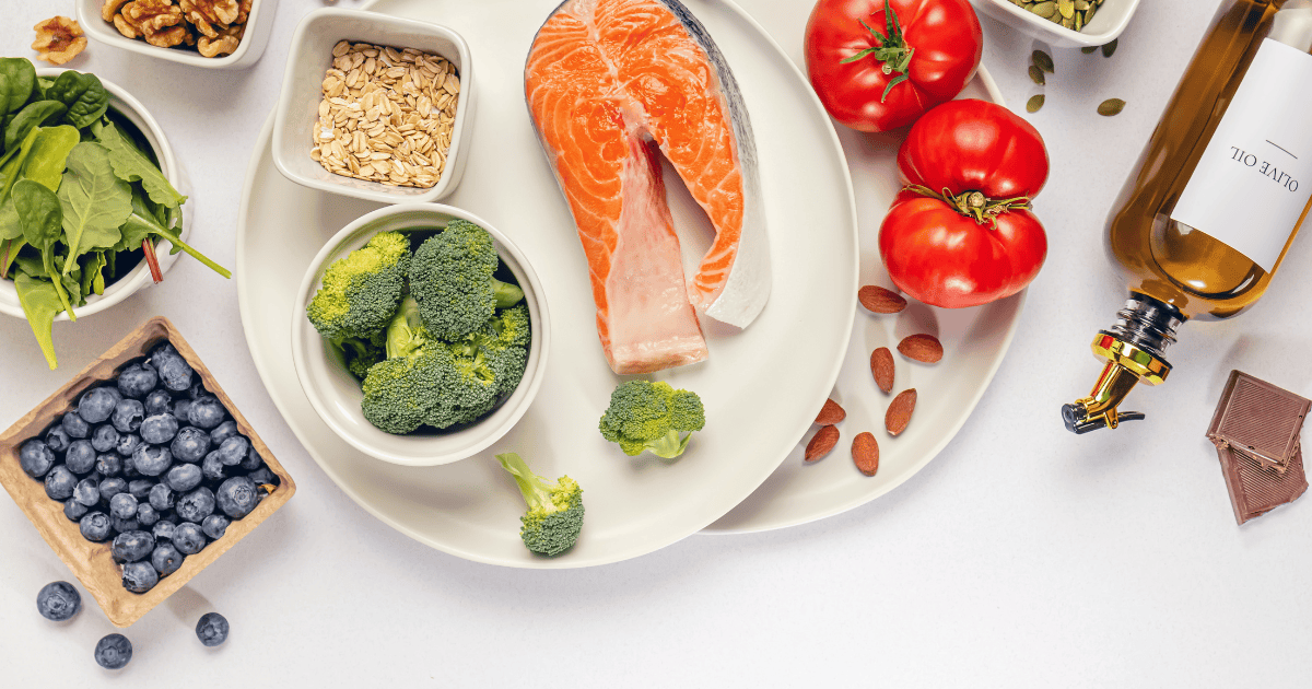 Heart-healthy foods for lowering high blood pressure, including fish, vegetables, olive oil and oats