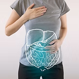 Women experiencing bloating with hand on belly - gut health dietitian nutritionist - IN GO