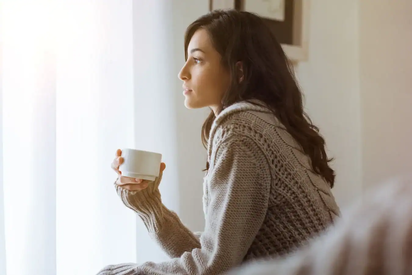 Eating Disorder Care, In good Nutrition. Woman Looking Outside of the window with Cup in hand